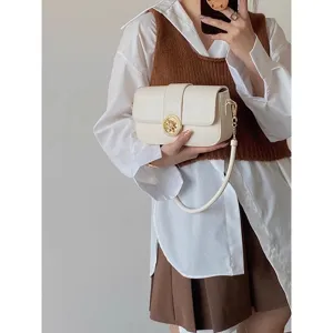 Chic vintage shoulder bag for women, elegant faux leather crossbody bag with chic gold buckle.
