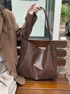 Detail view of the brown soft PU leather tote bag, showcasing large capacity and lazy style.