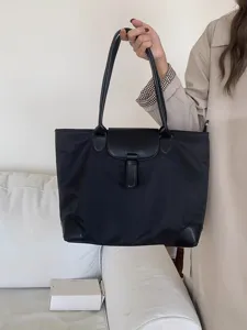 Large capacity nylon tote bag for women, stylish commuting handbag with leather flap.