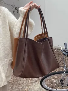 Soft large capacity leather tote bag for women, retro Korean style casual shoulder bag detail.