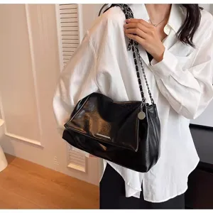 Stylish black faux leather shoulder bag for women, chic underarm design with chain strap.