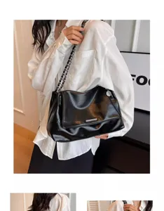Stylish black faux leather underarm shoulder bag with metal chain strap for women chic daily.