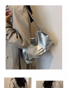 Stylish silver metallic underarm shoulder bag with chain strap for women autumn fashion.