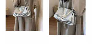 Silver metallic underarm shoulder bag with chain strap, stylish autumn winter fashion acc.
