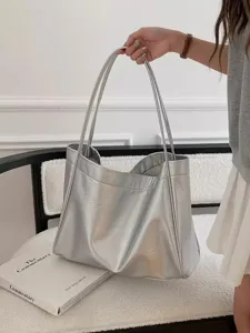 Detail view of the soft silver tote bag showing texture, large capacity, and daily styling.