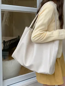 Casual large capacity tote bag for women, minimalist white shoulder bag detail view.