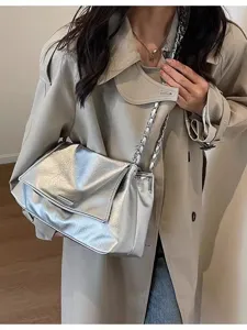 Large capacity metallic silver underarm shoulder bag for women, stylish niche design tote.