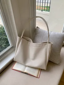 Minimalist beige soft PU leather tote bag, large capacity casual shoulder bag for women.