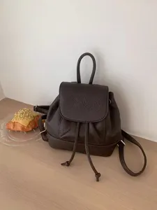 Stylish brown mini leather backpack for women, perfect for daily casual and travel use.