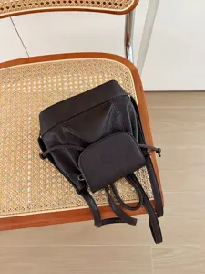 Mini dark brown leather backpack for women, cute casual travel daypack and school bag daily use.
