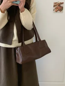 Classic brown shoulder bag for women, retro baguette bag, versatile casual underarm bag.