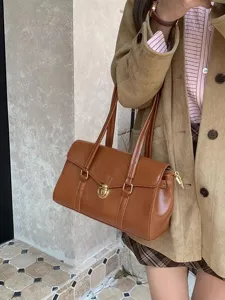 Retro brown leather underarm shoulder bag for women, minimalist commute tote handbag daily.