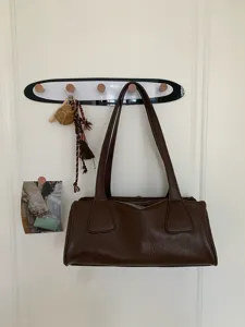 Retro brown leather underarm bag, classic vintage baguette shoulder bag for women daily commute.