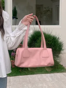 Chic pink shoulder bag for women, stylish vintage baguette purse, elegant daily commuter handbag.