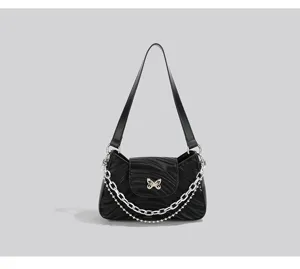 Black wavy baguette shoulder bag with chic butterfly chain, elegant underarm purse for women