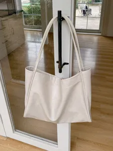 Minimalist soft leather tote bag for women, large capacity casual shoulder bag for daily commute.