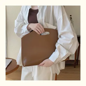 Minimalist brown 13 inch laptop sleeve and document business bag for women elegant daily commute use.