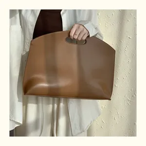 Minimalist brown leather 13-inch laptop bag and elegant commuting briefcase for women
