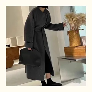 Minimalist black leather laptop handbag showcasing sleek design and daily commuting style.