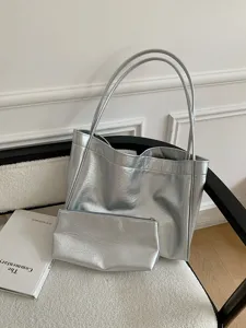 Silver metallic soft leather tote bag with matching pouch, stylish commuter shoulder bag.