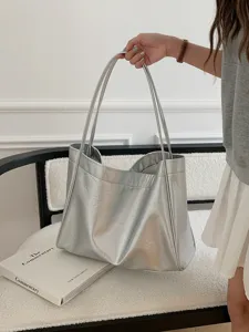 Detailed view of the stylish silver soft leather tote bag, perfect for daily commute and casual use.