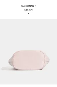 Pink bucket bag bottom detail view, fashionable design casual handbag base presentation.