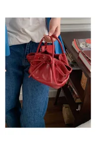 Borsa a secchiello lucida rossa con fiocco borsa a mano elegante donna moda tendenza