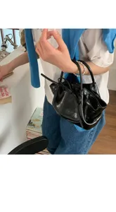 Borsa a mano in pelle verniciata nera da donna, elegante borsa secchiello fiocco moda.