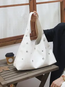 White leather shoulder bag with metal eyelets stylish hobo handbag for women daily commuting