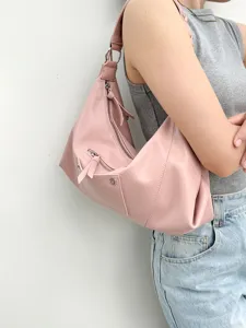 Pink leather shoulder bag for women, stylish hobo underarm bag with zipper pockets.