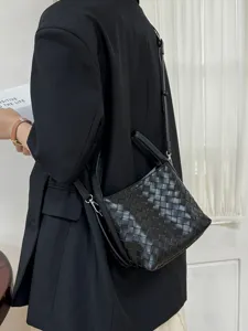 Chic woven leather bucket bag, stylish shoulder crossbody design for modern daily wear.