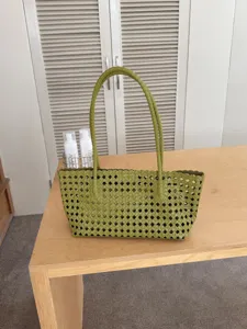 Green woven shoulder tote bag, stylish summer vacation basket bag for women daily commute.