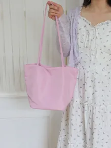 Casual pink nylon tote bag for women, lightweight large capacity shoulder commuting bag daily.