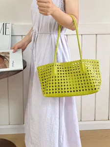 Detailed view of women's lime green woven tote bag, stylish summer shoulder handbag.