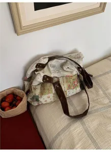 Detail view of Korean floral canvas patchwork tote bag with lace trim and brown leather shoulder strap.
