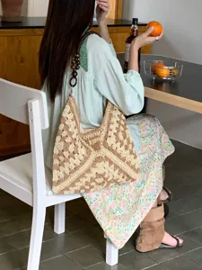 Summer hollow crochet shoulder bag detail, brown and beige granny square design with beads.