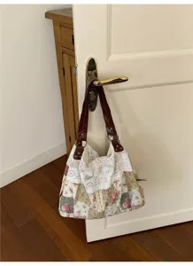 Detail shot of Korean floral lace shoulder bag hanging on wooden door in cozy home setting.