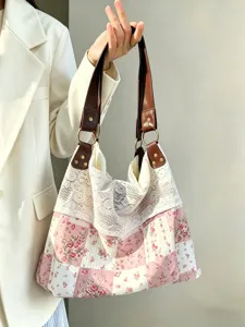 Detailed view of vintage floral patchwork shoulder bag with elegant white lace trim.