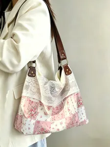 Vintage floral patchwork detail with delicate white lace trim on retro shoulder bag.