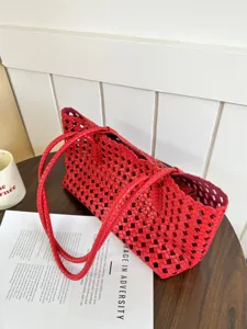 Red woven leather tote bag detail, stylish large capacity shoulder bag for summer commuting.