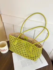 Green woven hobo shoulder bag for women, spacious casual tote and summer handbag detail.