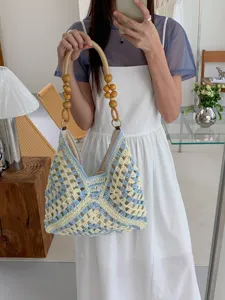 Summer hollow crochet straw tote bag with wooden bead handles for beach holiday women