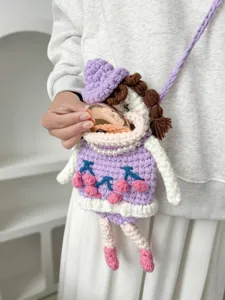Handmade crochet cute doll crossbody phone bag with cherry pattern, stylish knit shoulder bag.