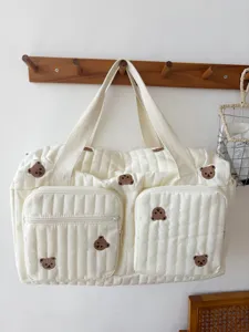 Quilted travel duffel bag with cute embroidered bear design, large capacity and lightweight.