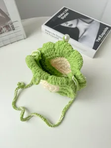 Handmade crochet flower crossbody bag, green knit sunflower bucket bag with pearl clasp.