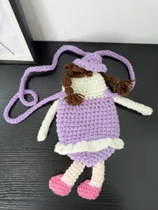 Handmade crochet doll crossbody phone bag, cute knitted cartoon shoulder bag for women.