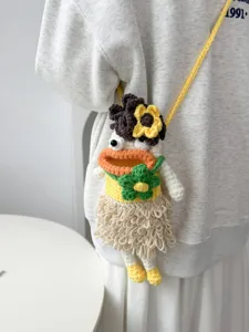 Handmade crochet phone bag with cute cartoon character design, perfect stylish knitted crossbody.