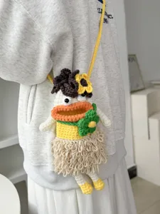 Handcrafted crochet cartoon doll crossbody phone bag, cute big mouth knit shoulder bag for women.