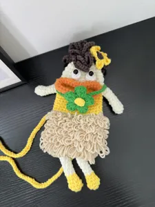 Handcrafted crochet big mouth girl phone bag detail, cute cartoon knit crossbody bag design.