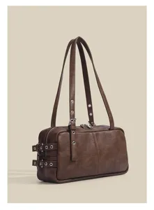 Retro brown boston shoulder bag with metal grommets and dual straps for women detail view.
